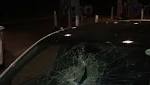 Driver unhurt after brick smashes