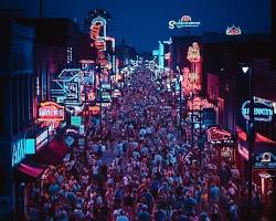 Image of neon lights and bustling crowds on Walking Street