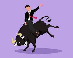 Image of person riding a bull with a stock chart background