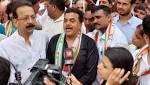 Congress workers count fill potholes