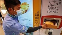 In wealthy Dubai, poor get free bread from machines
