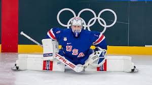 Olympic hockey boards replaced with lighter color after player feedback