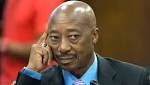 Jacob Zuma stands with Moyane