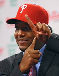 PHILADELPHIA - July 15: Pedro Martinez of the Philadelphia Phillies explains to the media the size of the needle injected into his shoulder on July ... - Philadelphia%2BPhillies%2BIntroduce%2BPedro%2BMartinez%2BFds0k3lihxHl