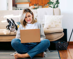 Image of Person working on laptop at home