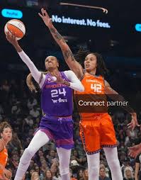 Licensable picture: Phoenix Mercury forward DeWanna Bonner (24) shoots the ball as Connecticut Sun center Brittney Griner (42) defends at Mortgage