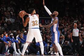 LeBron moonlights at center, helps limit Knicks' Towns in winning Sixers debut — ESPN
