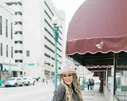 Image of woman wearing a dress, a jacket, and high heels in Texas