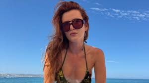 Bella Thorne Lounges on the Beach in Skimpy Sequin String Bikini