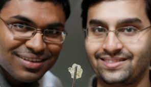 The Soytronics team that includes Anand Venkatesan, left, and Aniruddha Kelkar invented this soybean-based resin that can be used to make computer circuit ... - soytronics