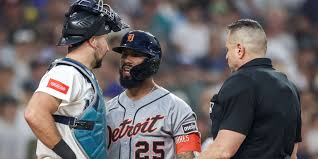 Detroit Tigers and Seattle Mariners players during a tense MLB game