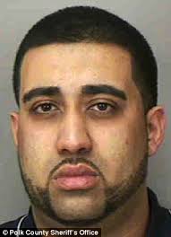 Caught: Mohammed Ahmed, 21, pictured, was arrested for soliciting a prostitute last week while he was honeymooning with his new wife in Florida - article-2324594-19C78129000005DC-305_306x423