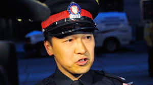 (Victor Biro / THE CANADIAN PRESS). Toronto Police Const. Victor Kwong updates the media on the Eaton Centre shootings in Toronto, Saturday, ... - image