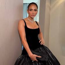 Jennifer Lopez Wears Glamorous Body-Hugging Black Gown to Taylor Swift’s Wedding