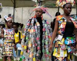 Image of model wearing a dress made from recycled materials