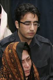 Bilawal Zaradri, son of slain former prime minister of Pakistan, Benazir Bhutto, sits at the grave of his mother with his aunt Sanam Bhutto on Saturday, ... - Bilawal-Zardari-Sanam-Bhutto