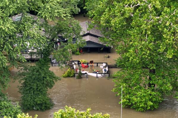 Severe flooding prompts emergency declarations in Indiana as at least 5 die; White River crests above 1913 records