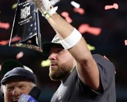 Image of Brandon Staley celebrating with the Super Bowl trophy