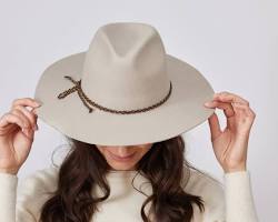 صورة woman wearing a fedora hat