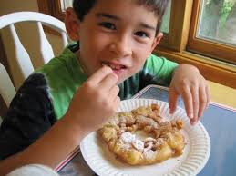 My oldest son enjoying a funnel cake snack! Photo: Patricia Vollmer - IMG_2612-475x356