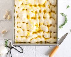 Image of shaped focaccia dough with dimples