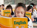 Primary school students in China begin learning a foreign language.