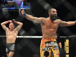 Johny Hendricks putting his arms up in belief of his victory