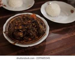 Gambar Tengkleng RicaRica Pak Manto, a spicy goat meat stew served with rice