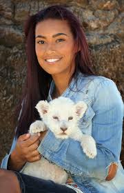 Chantelle Tagoe, the fiancee of England international football player Emile Heskey, sits with Acinonyx the six week old white Lion cub at ... - Chantelle%2BTagoe%2BVisits%2BCheetah%2BSanctuary%2BBloemfontein%2B_NgPNsqszQal