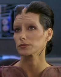 In the episode &#39;The Passenger&#39; an injured Kobliad Security officer, Ty Kajada (Julie Caitlin Brown), is rescued from a burning ship. - ds9tykajada2