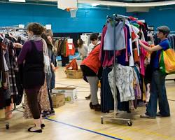 Image of person shopping at a thrift store or clothing swap event