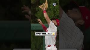 Watch: On the first pitch Brandon Marsh robs Ronald Acuña Jr. #robbed #mlb #acuna #phillies #marsh
