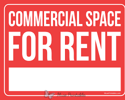 Image of commercial building with a For Rent sign