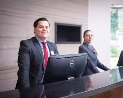 تصویر hotel staff wearing a uniform