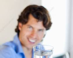 Image of Person drinking a glass of water
