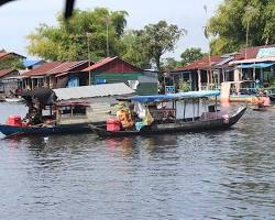 Image of Chong Khneas floating village on Tonle Sap Lake, with houses, schools, and markets on water