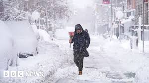 More than 5,000 flights cancelled as US east coast digs out of record snow