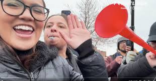 Couple and daughter charged with assaulting reporter outside Whipple Building