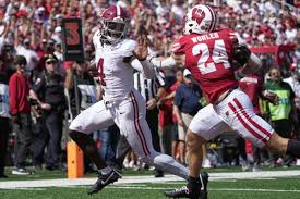 AP Player of the Week: Alabama's Jalen Milroe has hand in 5 TDs against Wisconsin and 14 for season