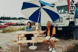 Don Hisaka and Mignon O&#39;Young sitting in front of a lobster roll truck in Maine during a working vacation at the client&#39;s. (Photo by Michiko Hisaka) - 02-a-40-IMG_6898-550x366