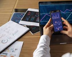 Image of person using a smartphone or tablet to manage their investments