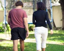 Image of teenager walking away from parent