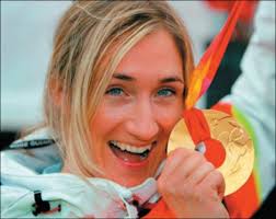 Swiss rider Tanja Frieden with her Gold medal from the 2006 Winter Olympics. Image courtesy of live-wintersport.com. - tanja-frieden-gold-medal