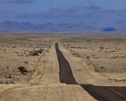 Image of desert with a mysterious ranch in the distance