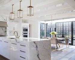 Image of modern kitchen featuring a waterfall marble island