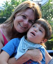 BETTER ACCESS: Jethro Taylor, 7, pictured with mum Shelley Clarke, 46, needs a new van to help him travel safely and more comfortably. - 9861514