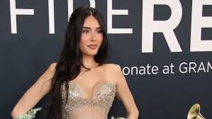 Madison Beer in a black body-hugging gown