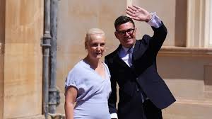 Prime Minister Andy Burnham and his wife, Marie-France van Heel, leave Buckingham Palace on Monday. Pic: PA