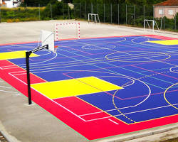 Image of outdoor basketball court with asphalt surface