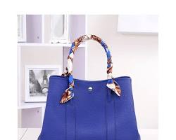 Image of leather tote bag in a deep sapphire blue color